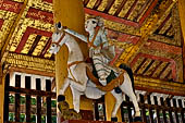 Bagan Myanmar. Shwezigon pagoda. Brightly coloured figures narrating Siddhartha Gautama and the characters he encountered on his travels, the old man, the sick man and the dead man.  